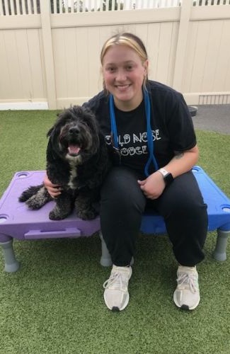 woman sitting with dog